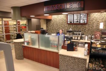 coffee shop counter with 'immaculata' sign