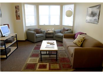 cozy student lounge with couches and table