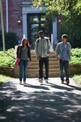 three students walking down the steps