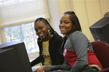 two students working on computers