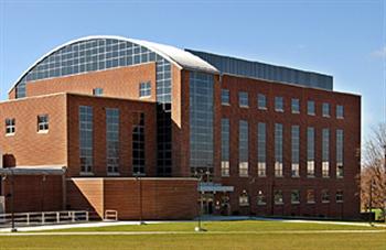 modern building with glass dome and brick exterior