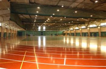 indoor sports facility with red flooring