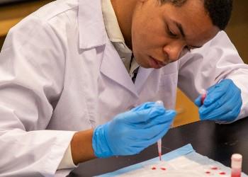 student conducting an experiment in a lab