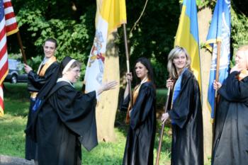 academic procession with flags and robes