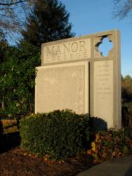 stone sign with 'manor college' engraved