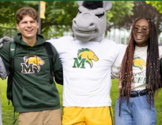 students with mascot in green and yellow attire