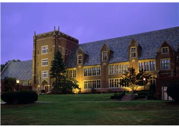 lit up historical building at dusk