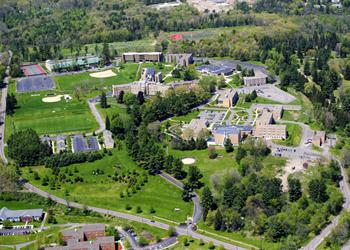 aerial shot of green campus with multiple buildings