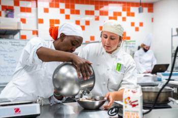 students cooking in a culinary academy