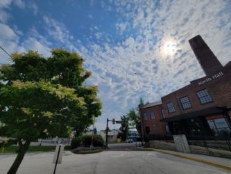 sunny day with scattered clouds over campus