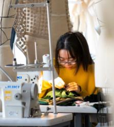 student sewing in an art class