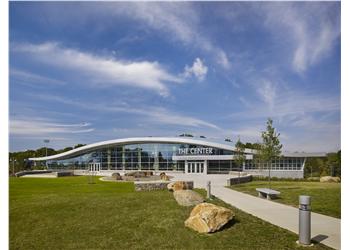 building with 'THE CENTER' text and clear skies