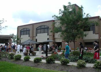 people gathered outside campus building