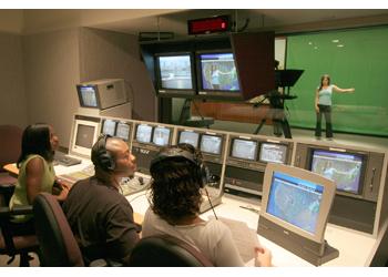 students in broadcast studio control room