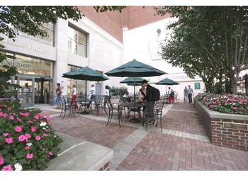 outdoor campus seating area with umbrellas