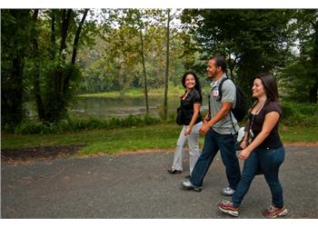 students walking by a lake