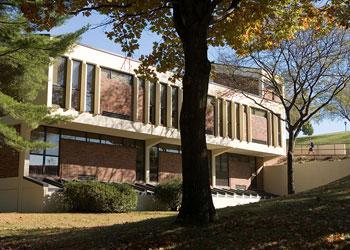 building with columns and autumn trees