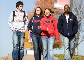 four students walking on university campus