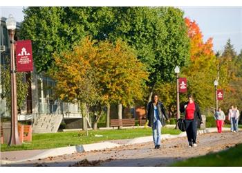 students walking on campus with banners