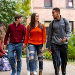 students walking and talking on campus