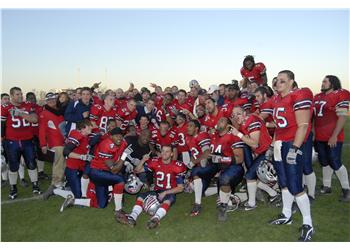 football team celebrating on the field