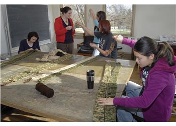 students working on a textile project in class