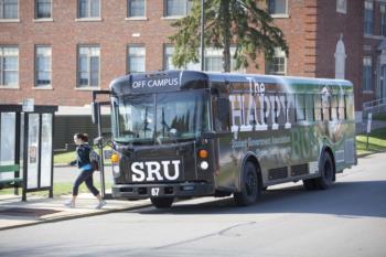 student boarding the 'happy bus' at sru