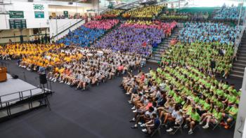 new students seated in colorful sections