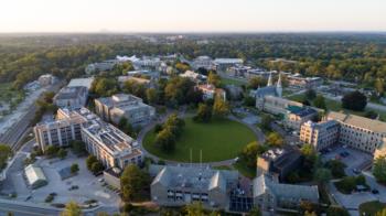 aerial view of campus with buildings and green space