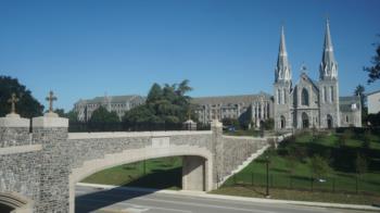 stone bridge leading to gothic church