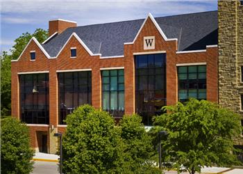 red brick building with large 'W' on window