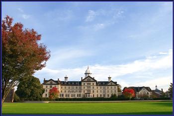 historic building with a blue sky and green lawns