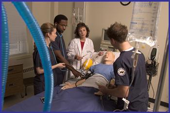 nursing students practicing on a mannequin