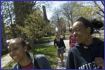 students chatting and walking on campus