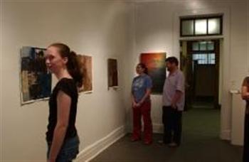 people viewing artwork in a gallery