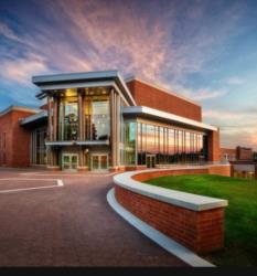 modern campus building at dusk with vibrant sky