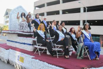 parade float with people waving