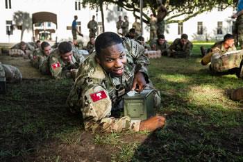 cadet operating a radio during a field exercise