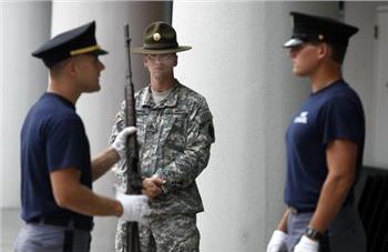 three military personnel in a discussion