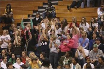 crowd cheering at an indoor event