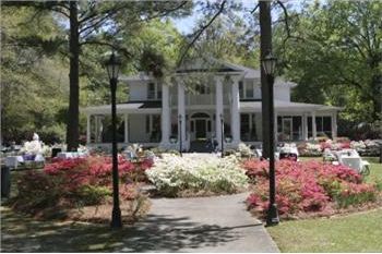 house with outdoor seating and flowers