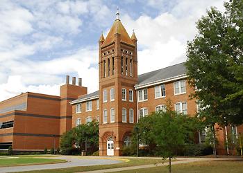 historic campus building with a tower