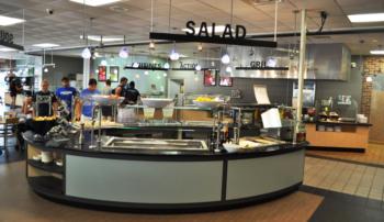 college cafeteria with salad bar and students