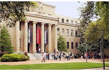 students walking near building with banners