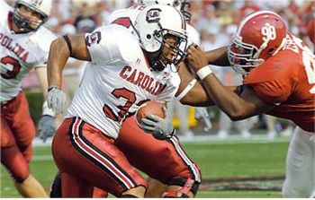 football player running with the ball