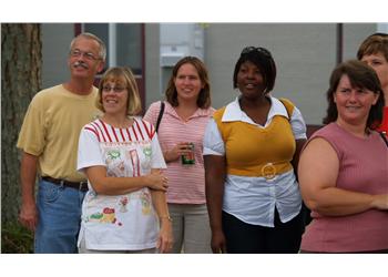 group of people smiling and standing