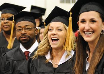 graduates smiling during commencement