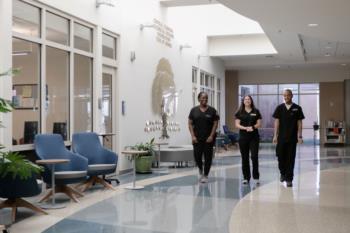 students walking through campus lobby