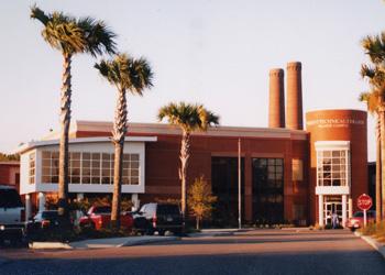 university building with palm trees