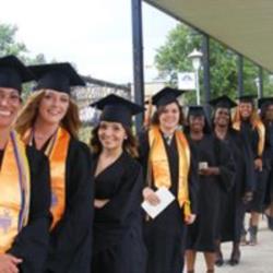 line of graduates in caps and gowns